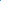 A scuba diver swims through blue ocean water.